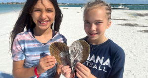 Two girls with a penshell on a Marco Island shelling tour