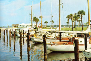 Sailboats tied up at boat slips on Marco