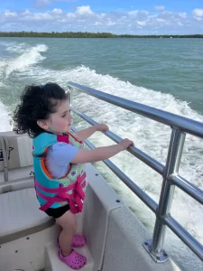Having fun on her first boat tour on Marco Island