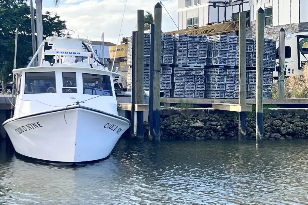 Stone crab traps and stone crab fishing boat in Goodland